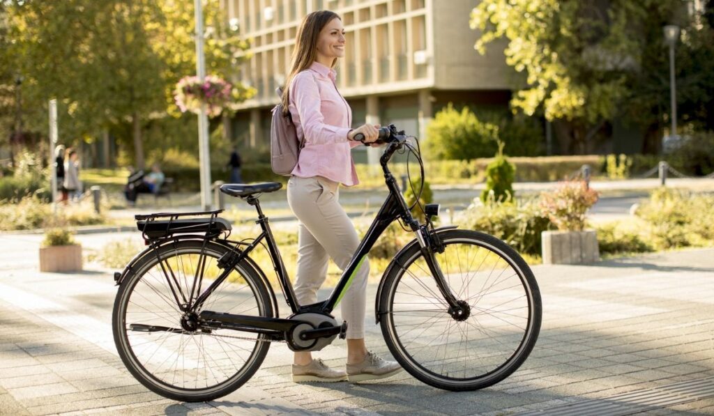 Woman in city with Electric E-Bike