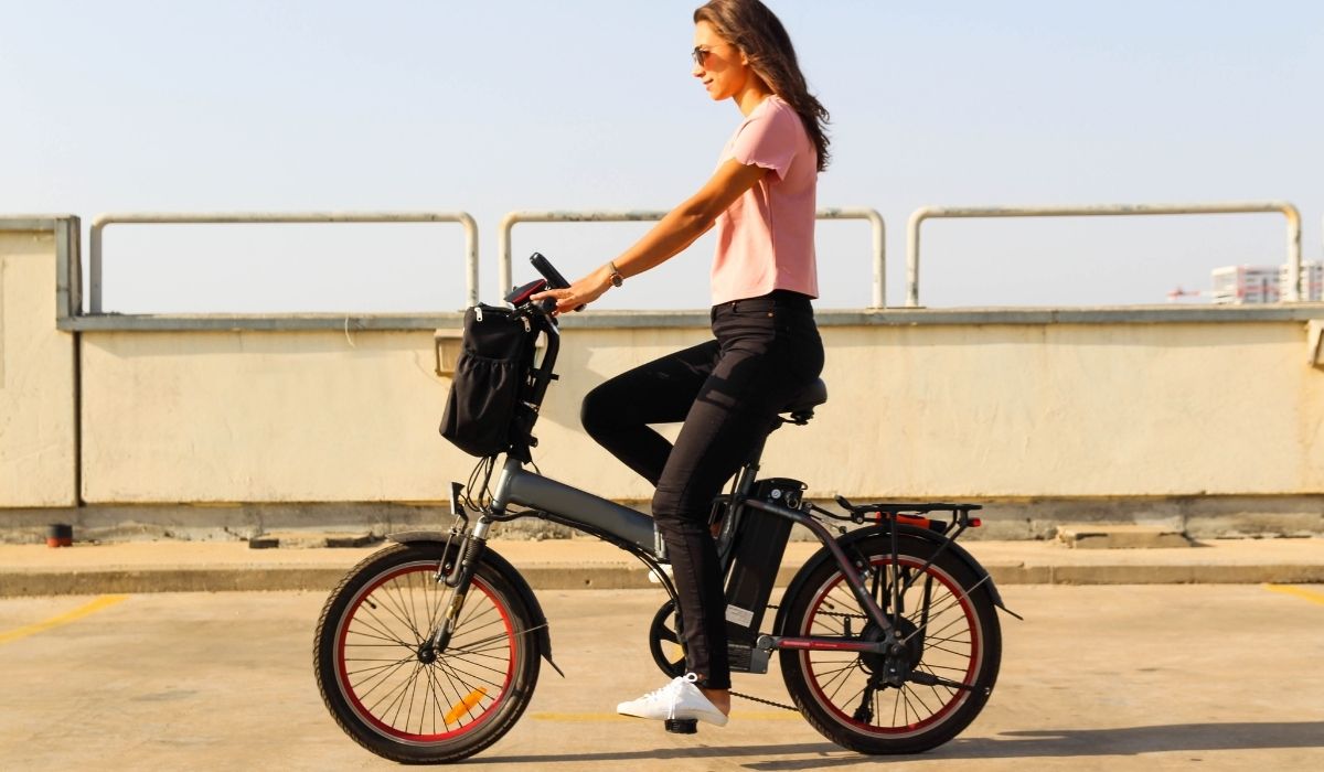 Young woman riding an electric bicycle