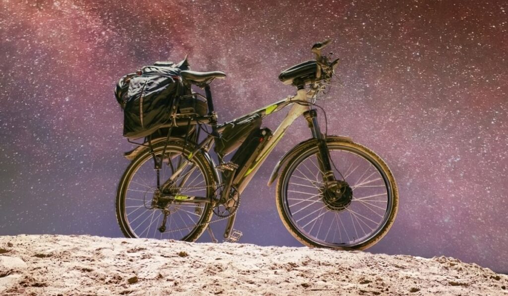 Illuminated electric bike under bright surreal starry sky