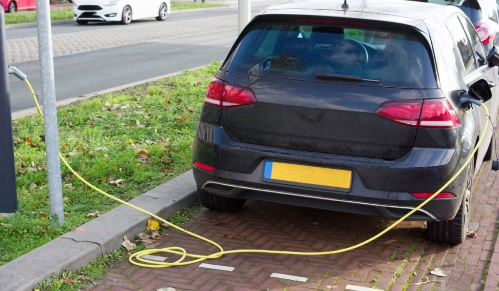 Electric car connected to charge station