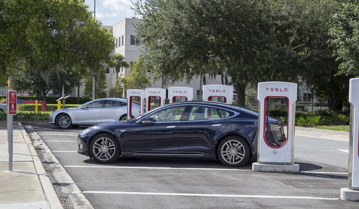 Cars at Tesla charging stations